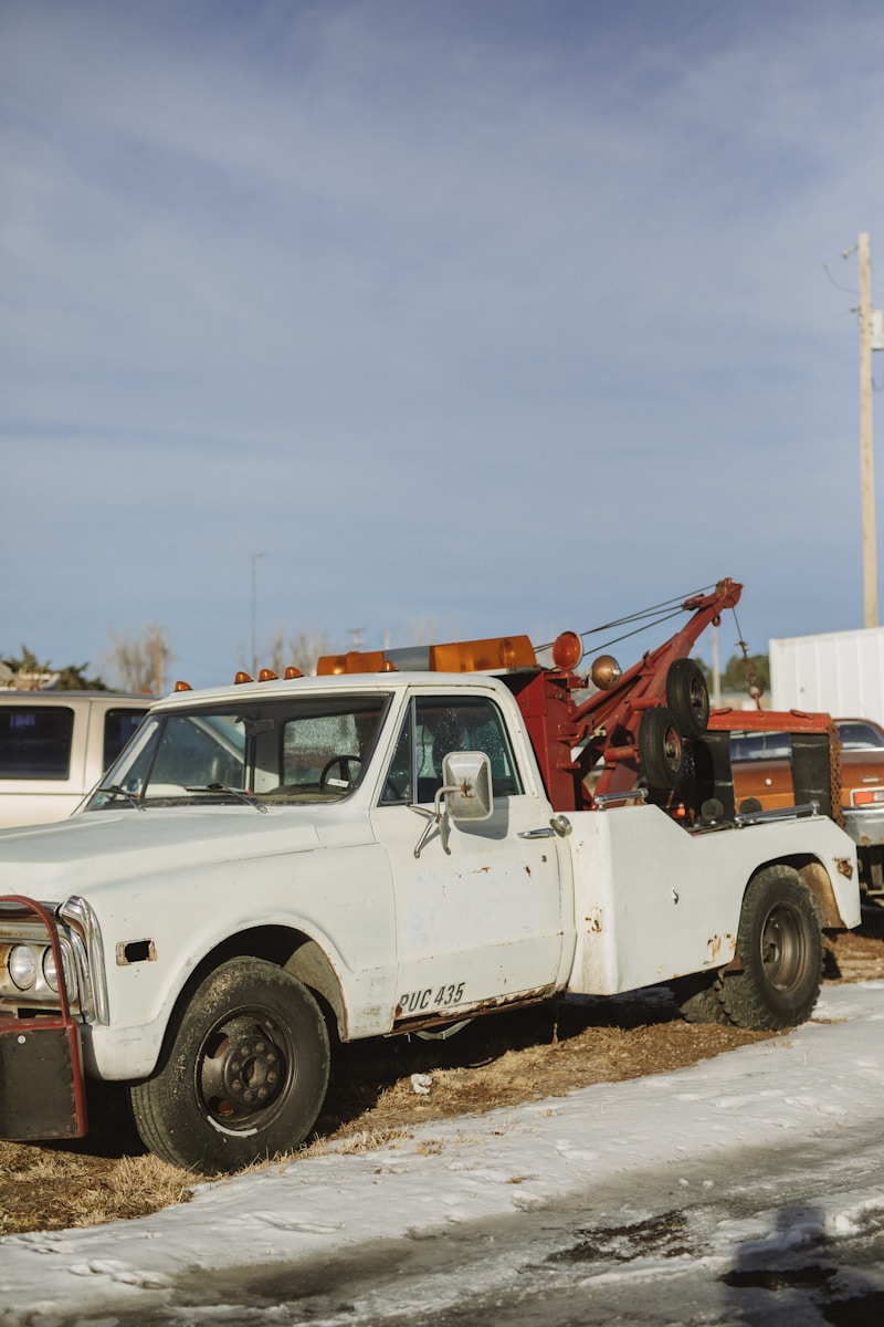 white single cab pickup truck on road during daytime