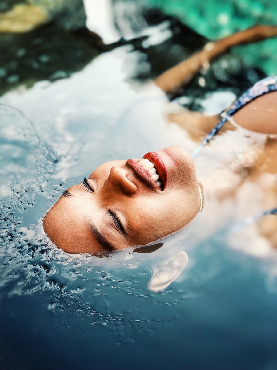 floating woman on body of water